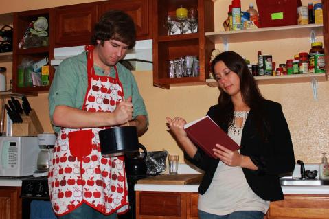 Rhodes Scholar Amanda Frickle now wears the pants in the relationship; doting boyfriend Brent Zundel wears the aprons. Photo by Brent Zundel.